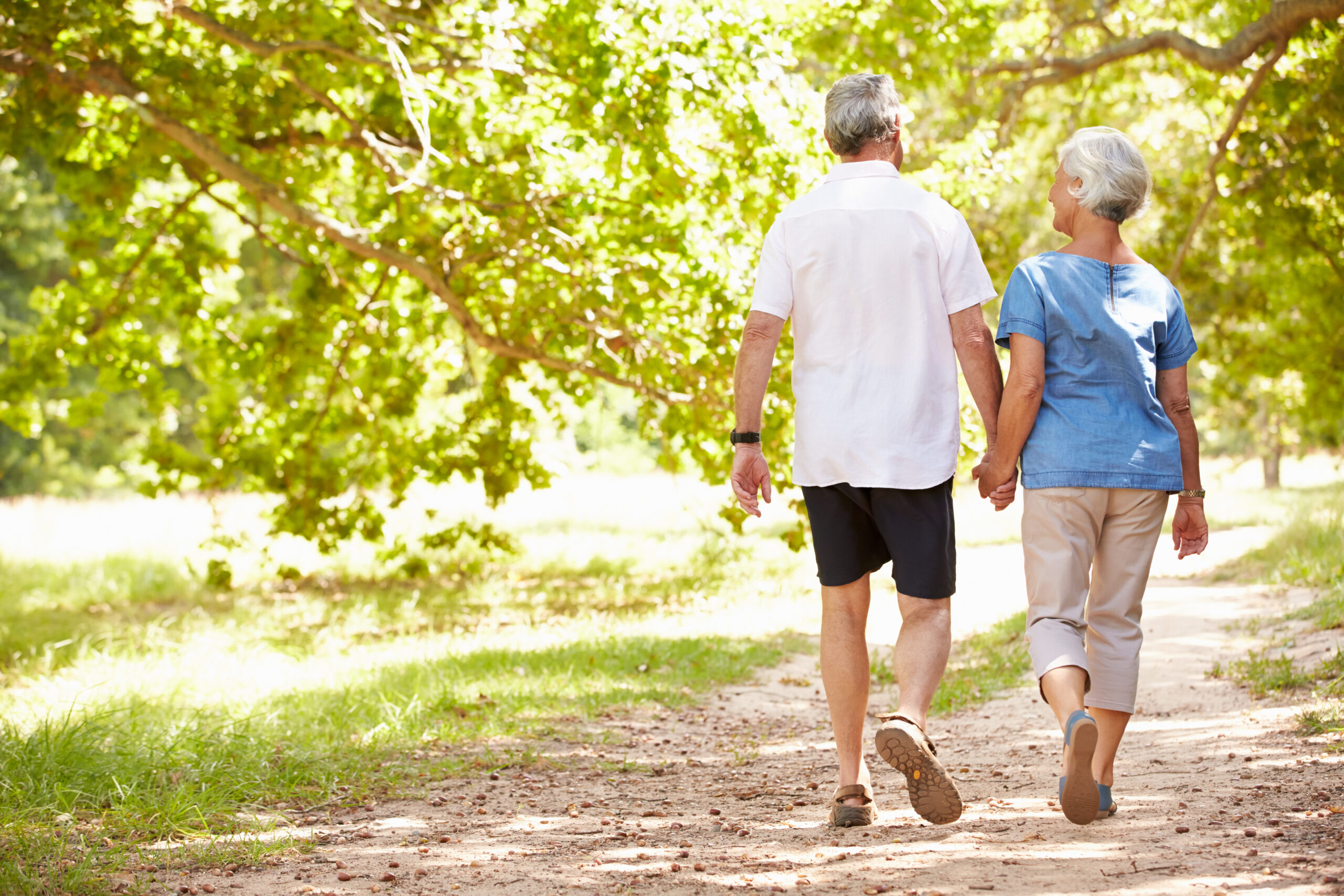 Senior couple walking in Alzheimer care services.